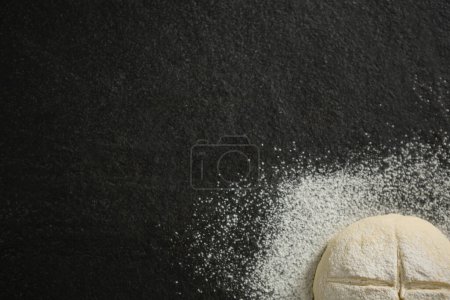 Photo for Cropped image of flour on unbaked bun - Royalty Free Image