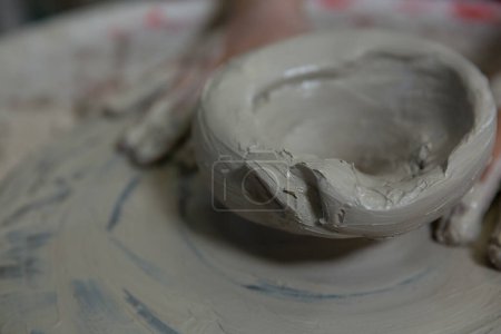 Photo for Close-up of hands of girl molding a clay - Royalty Free Image