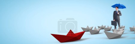 Téléchargez les photos : Busnessman avec parapluie entouré de bateaux en papier 3D - en image libre de droit