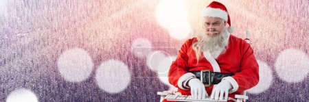 Photo for Santa with Winter landscape using keyboard - Royalty Free Image