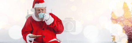 Photo for Santa with Winter landscape and cup and cookies - Royalty Free Image