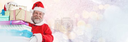 Photo for Santa with Winter landscape holding gifts - Royalty Free Image