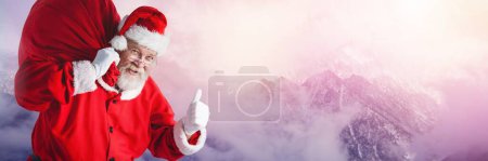 Photo for Santa Claus in Winter with sack - Royalty Free Image