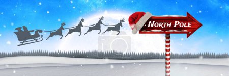 Photo for North Pole text on Wooden signpost in Christmas Winter landscape and Santa sleigh and reindeer - Royalty Free Image