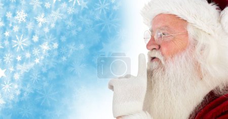 Photo for Santa hushing quiet and Snowflake Christmas pattern and blank space - Royalty Free Image