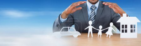Photo for Paper Cut Out family home and car with businessman's hands - Royalty Free Image