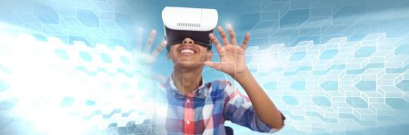 Photo for Boy wearing virtual reality headset with geometric transitions - Royalty Free Image