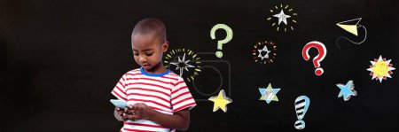 Photo for School boy and Question marks and stars drawing on blackboard - Royalty Free Image