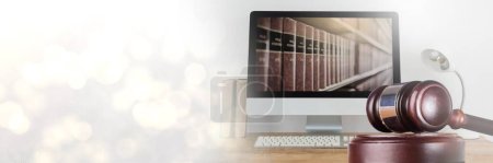 Photo for Gavel and computer with books of law and justice with transition - Royalty Free Image