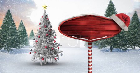 Photo for Christmas tree and wood sign in Winter snow forest - Royalty Free Image