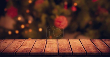 Photo for Wood surface and Christmas tree at home - Royalty Free Image