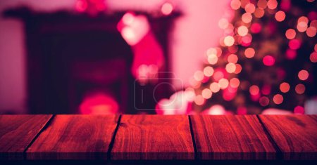 Photo for Wood surface and Christmas tree at home with stocking - Royalty Free Image