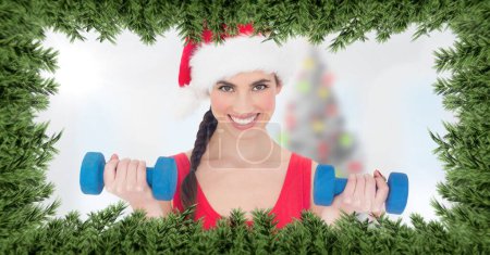 Photo for Christmas tree border and woman in gym - Royalty Free Image