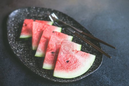 Photo for Close-up shot of fresh organic watermelon on tabletop for background - Royalty Free Image