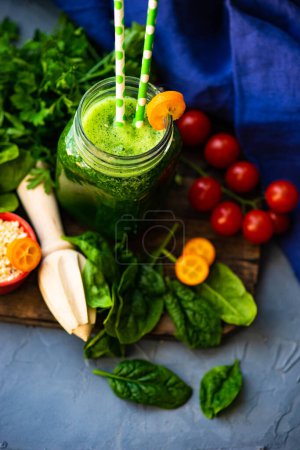 Photo for Close-up shot of fresh organic vegetable smoothie on tabletop for background - Royalty Free Image