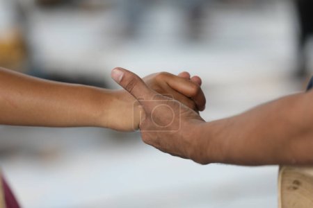 Photo for Loving couple holding hands, closeup - Royalty Free Image