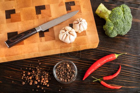 Photo for "Vegetables and spices on a cutting board" - Royalty Free Image