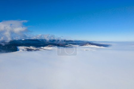 Photo for Flying drone above misty valley - Royalty Free Image