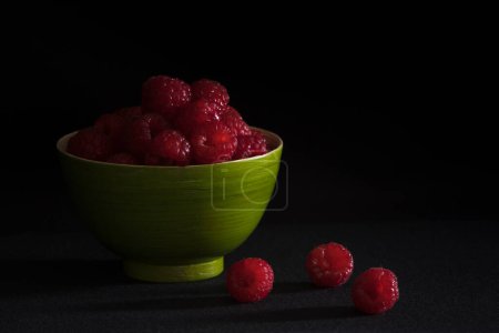 Photo for "Raspberries in a bowl" - Royalty Free Image