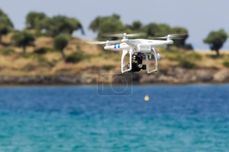 Photo for DJI Phantom drone in flight with a mounted GoPro Hero3+ Black E - Royalty Free Image