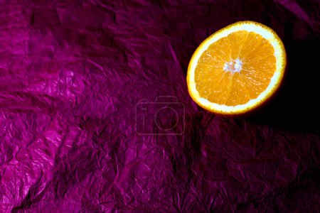 Photo for "Orange on a purple background" - Royalty Free Image