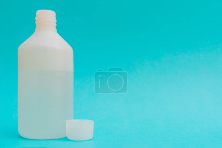 Photo for Disinfectant liquid in a white bottle. Therapeutic drug. - Royalty Free Image
