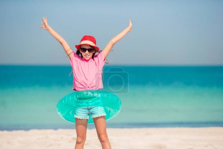 Photo for Adorable little girl at beach on her summer vacation - Royalty Free Image