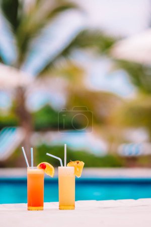 Photo for "Two tasty cocktails on tropical white beach" - Royalty Free Image