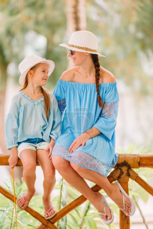Photo for Beautiful mother and daughter on Caribbean beach - Royalty Free Image
