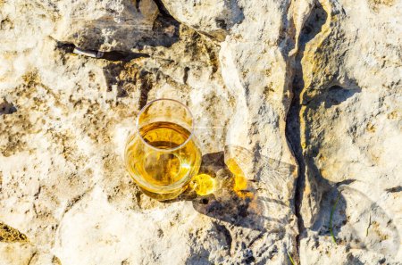 Photo for Glass of single malt whisky in glass on the rock - Royalty Free Image