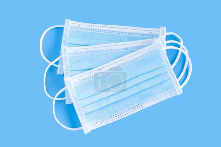 Photo for Medical masks isolated on blue background for protect air polution - Royalty Free Image