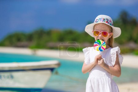 Photo for Adorable happy smiling little girl on beach vacation - Royalty Free Image