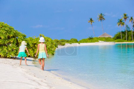 Photo for Little adorable girls drawing picture on white beach. Cute kids on summer holidays at Maldives - Royalty Free Image