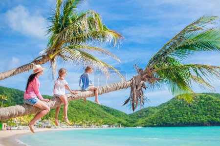Photo for Happy beautiful family on a tropical beach vacation - Royalty Free Image
