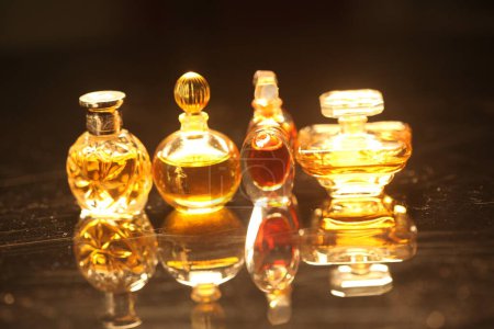 Photo for Perfume in a bottles on a dark background - Royalty Free Image