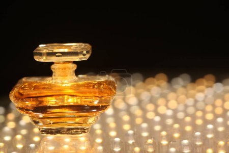 Photo for Perfume bottle with golden cap - Royalty Free Image