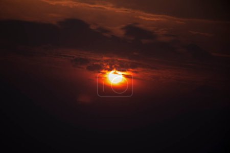 Photo for Cloudy sky golden sunlight, sun behind the clouds - Royalty Free Image