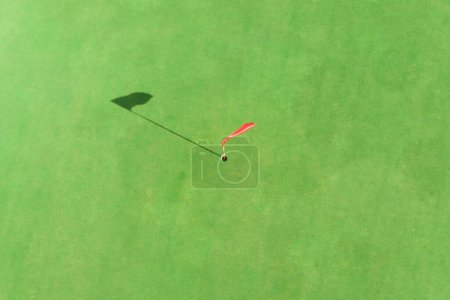 Photo for Top view of golf pole on the green in a golf course - Royalty Free Image
