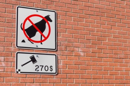 Photo for No dog pooping sign on brick wall - Royalty Free Image