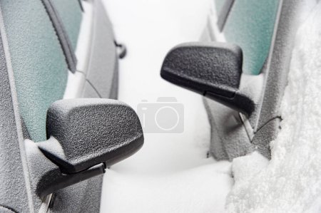 Photo for Car mirrors of two cars buried in the snow after snowstorm - Royalty Free Image