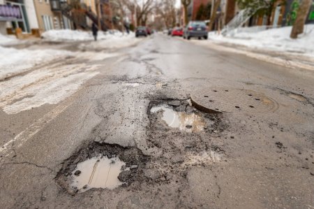Large potholes in Montreal street, Canada.