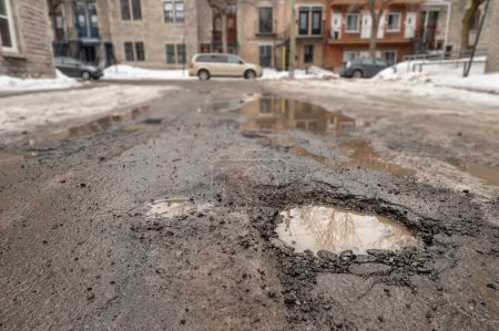 Photo for Large pothole in Montreal street, Canada. - Royalty Free Image