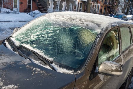 Photo for Thick layer of ice covering car after freezing rain in Montreal - Royalty Free Image
