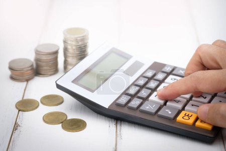 Photo for Man using calculator, business - Royalty Free Image