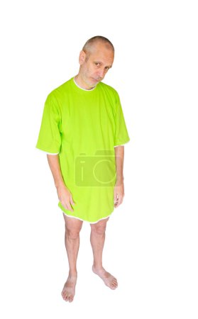 Photo for Tired Man in Green Nightdress - Royalty Free Image