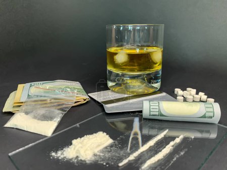 Photo for Rolled 100 us dollars, 2 lines of cocaine, a glass of whiskey - Royalty Free Image