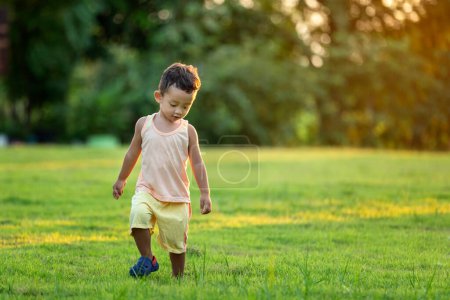 Photo for Happy child with dandelions in the countryside at springtime - Royalty Free Image