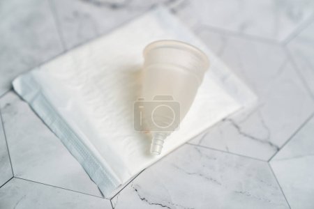 Photo for The choice between menstrual cup and sanitary napkin. - Royalty Free Image