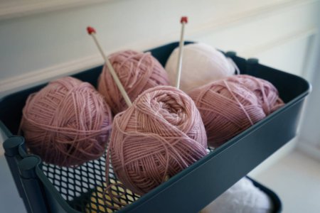 Photo for Pink knitting wool and knitting needles. - Royalty Free Image