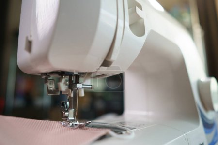 Photo for Closeup of fabrics and sewing machine for sewing - Royalty Free Image